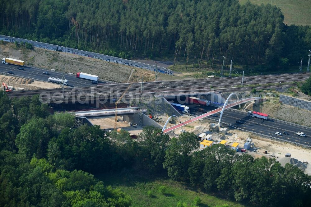 Michendorf from above - Construction for the renovation of the railway bridge building to route the train tracks crossing course of motorway BAB A10 in Michendorf in the state Brandenburg