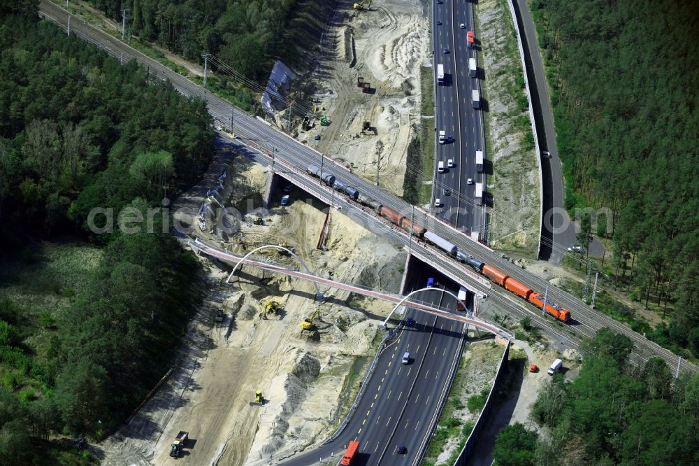 Aerial image Michendorf - Construction for the renovation of the railway bridge building to route the train tracks crossing course of motorway BAB A10 in Michendorf in the state Brandenburg