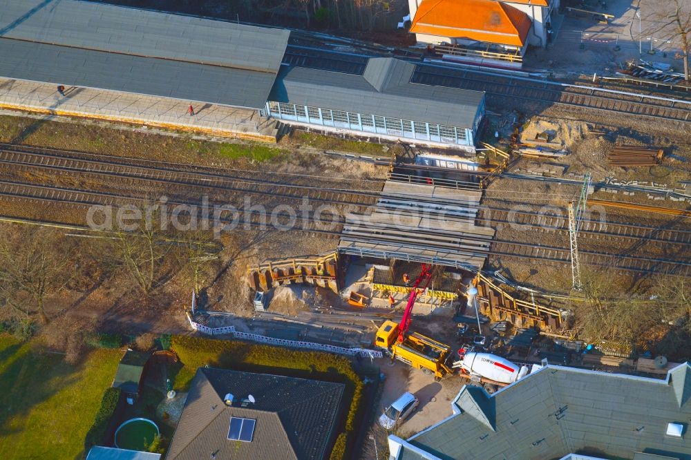 Aerial photograph Zepernick - Construction for the renovation of the railway bridge building to route the train tracks of station Roentgental on Heinestrasse in Zepernick in the state Brandenburg, Germany