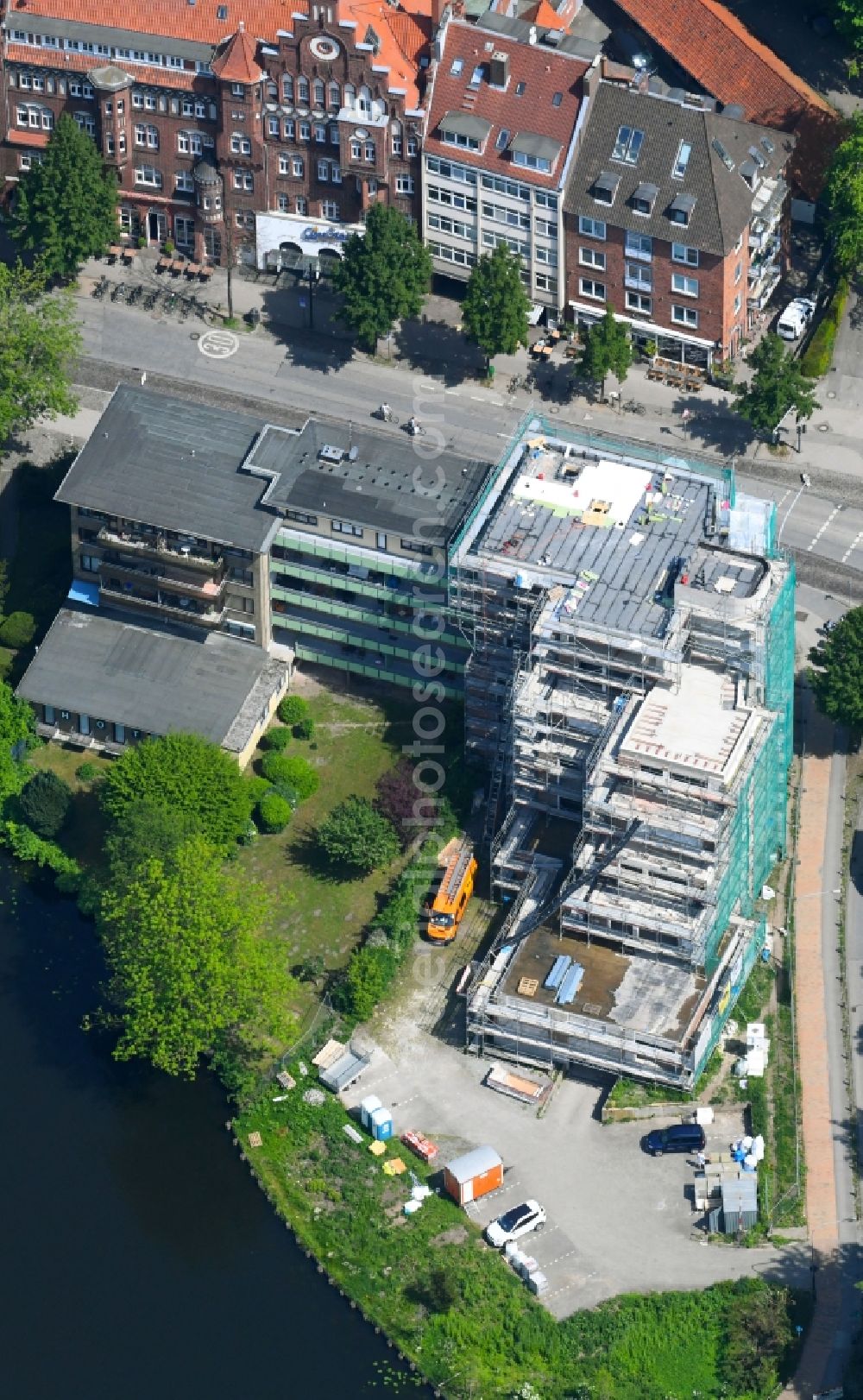 Lübeck from the bird's eye view: Construction site for the renovation of the hotel complex Hotel Am Muehlenteich on Muehlenbruecke in Luebeck in the state Schleswig-Holstein, Germany