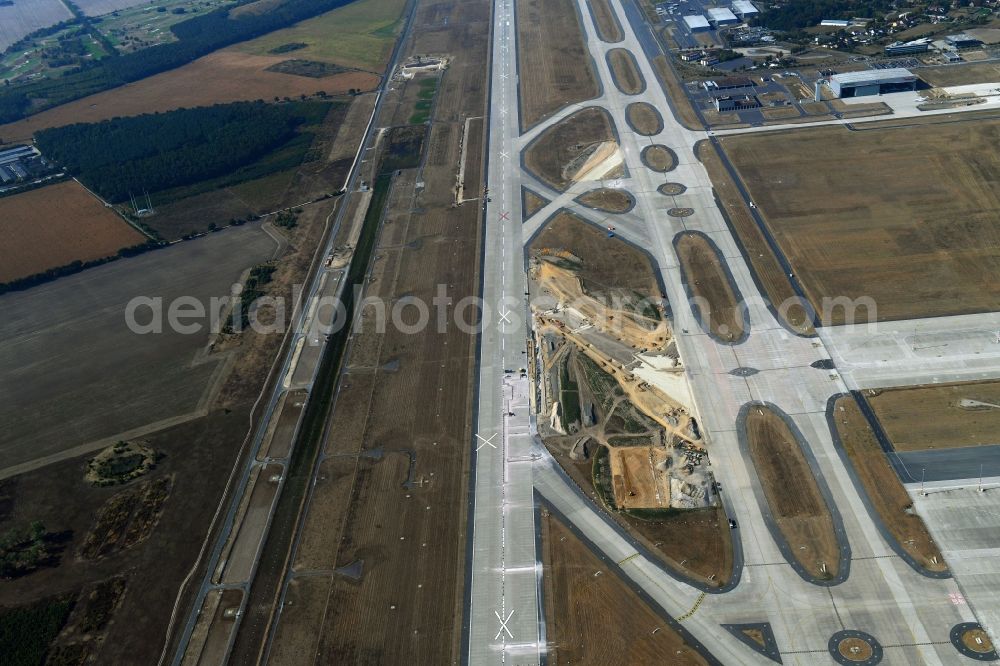 Schönefeld from the bird's eye view: Construction site for the rehabilitation of the southern runway on the airport grounds of BER Airport in Schoenefeld in the state of Brandenburg, Germany