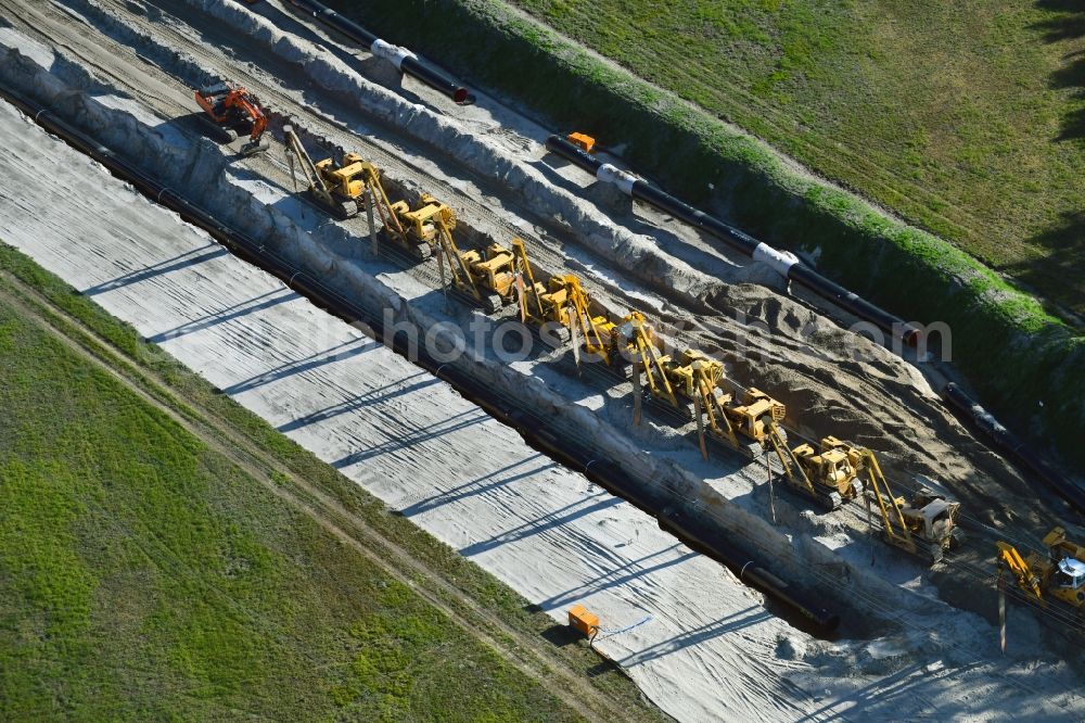 Aerial photograph Friedrichshof - Construction site with earthworks and landfills for the laying of pipelines of the new European Gas Lines (Eugal) on a field in Gross Koeris in the state Brandenburg, Germany