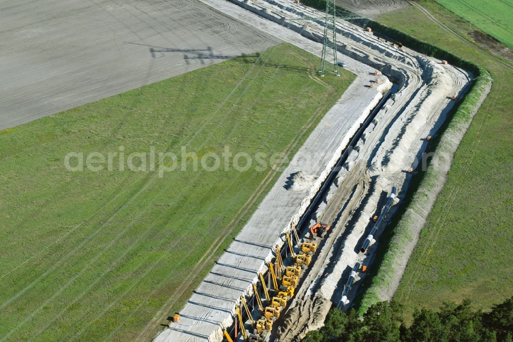 Friedrichshof from the bird's eye view: Construction site with earthworks and landfills for the laying of pipelines of the new European Gas Lines (Eugal) on a field in Gross Koeris in the state Brandenburg, Germany