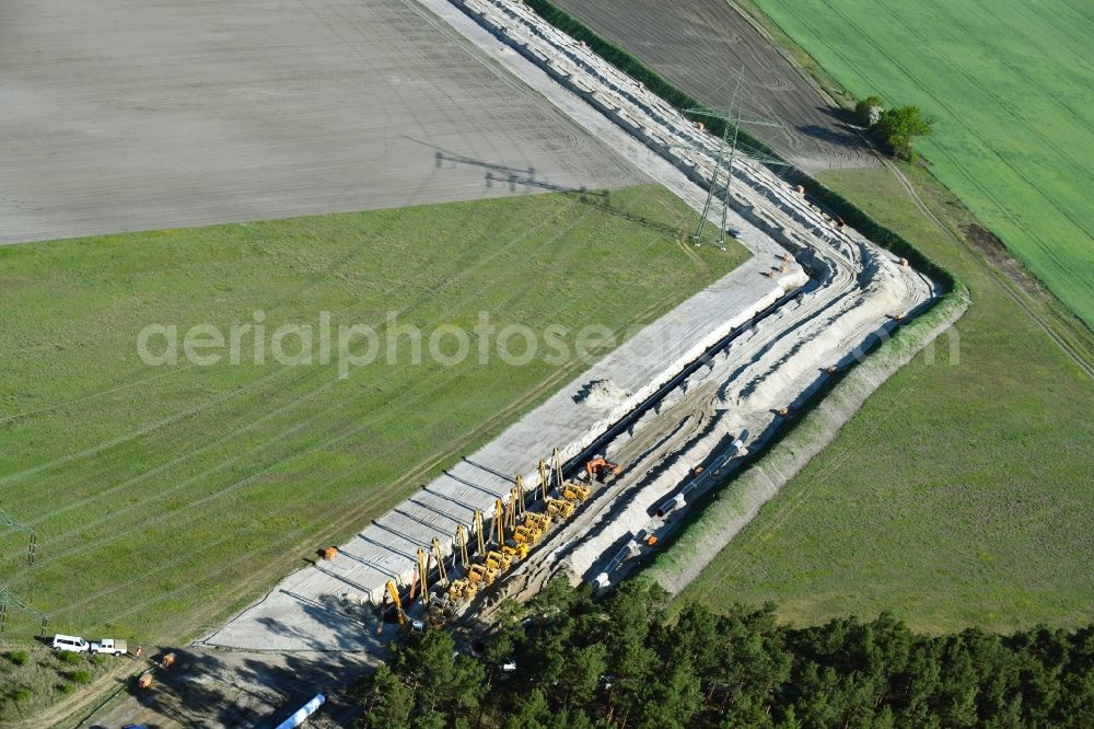 Aerial image Friedrichshof - Construction site with earthworks and landfills for the laying of pipelines of the new European Gas Lines (Eugal) on a field in Gross Koeris in the state Brandenburg, Germany