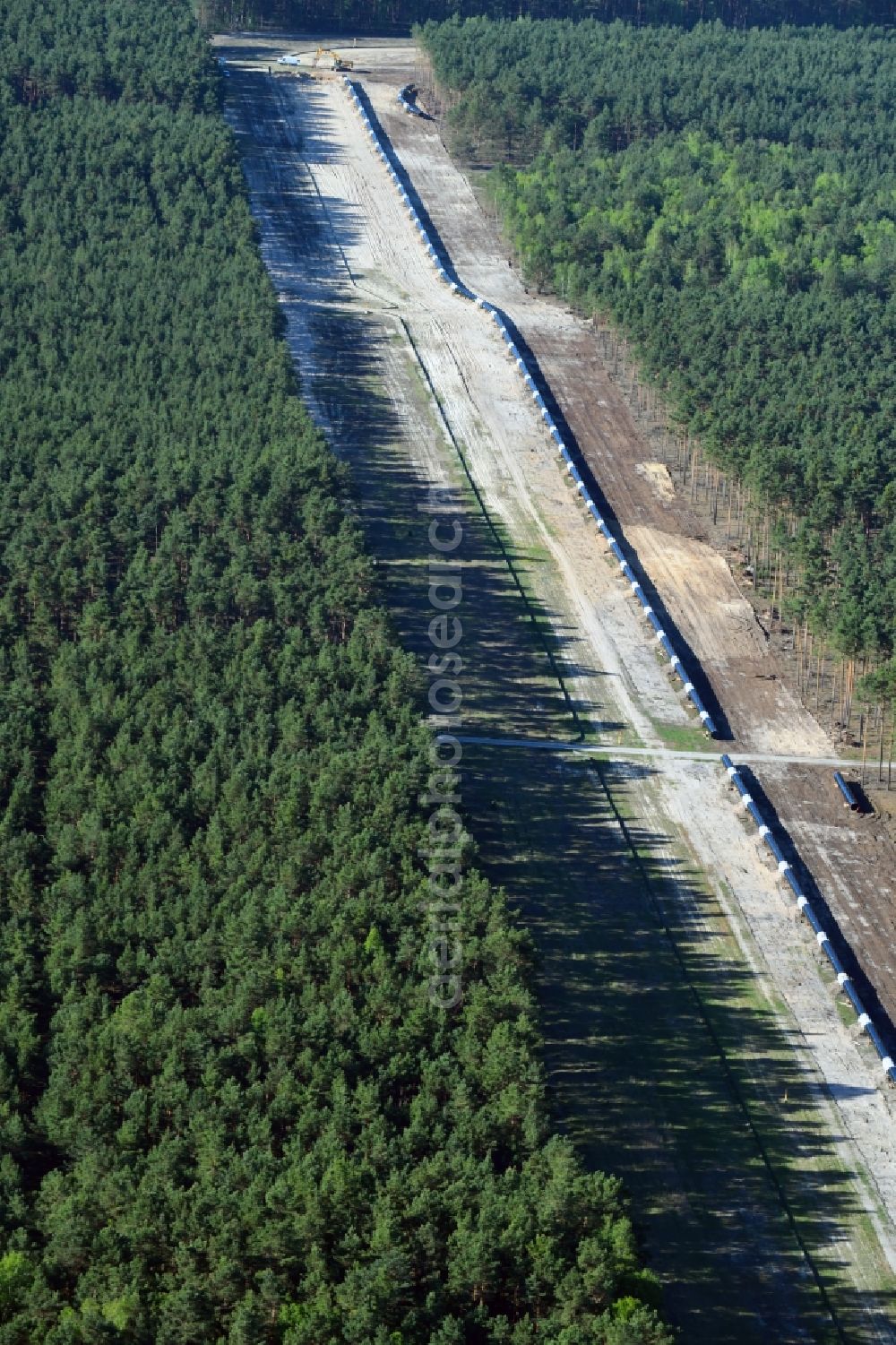 Aerial image Groß Köris - Construction site with earthworks and landfills for the laying of pipelines of the new European Gas Lines (Eugal) in a forest in einem Wald in Gross Koeris in the state Brandenburg, Germany