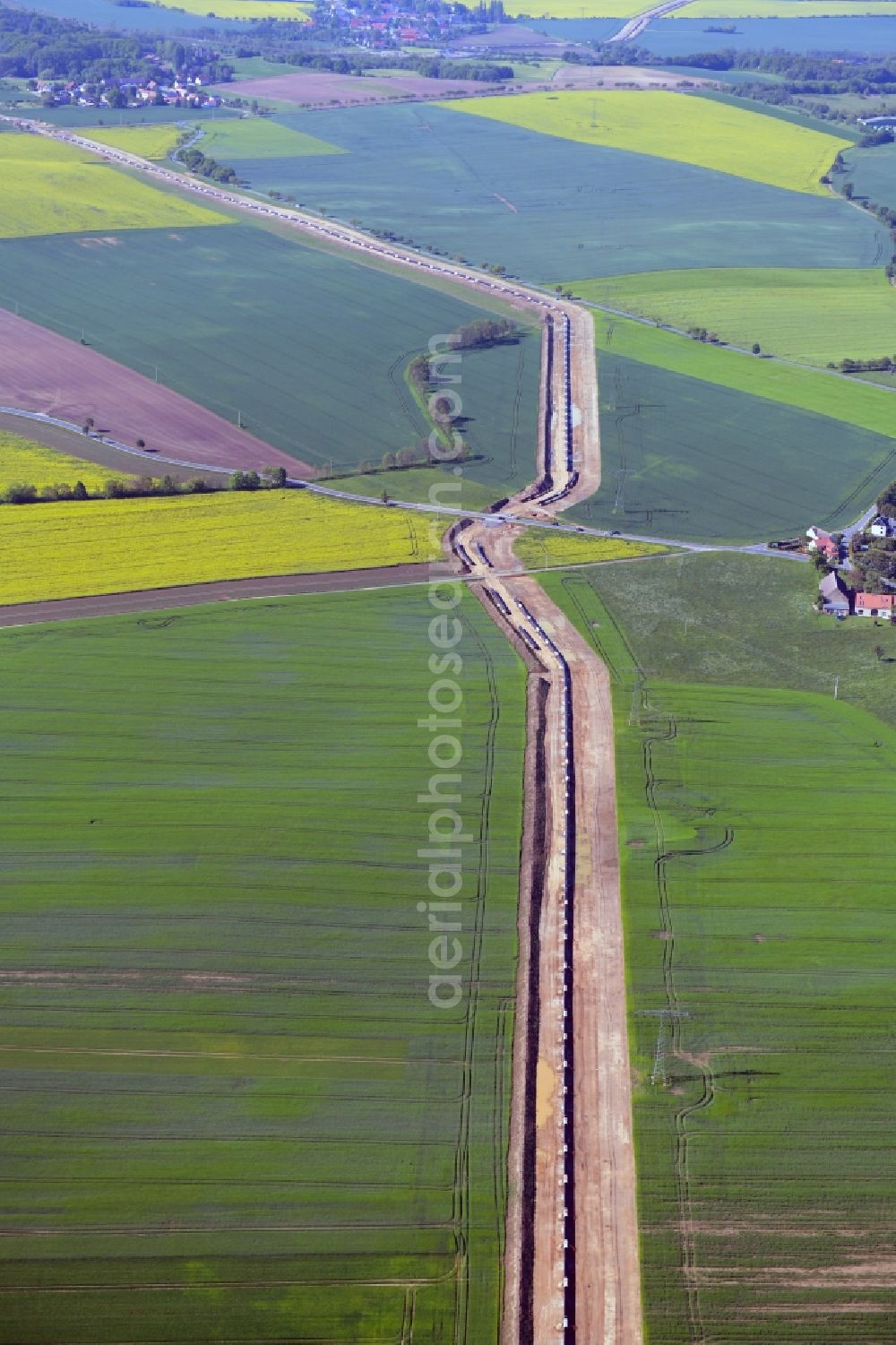 Aerial photograph Rostig - Construction site with earthworks and landfills for the laying of pipelines of the new European Gas Lines (Eugal) in a forest in einem Wald in Gross Koeris in the state Brandenburg, Germany