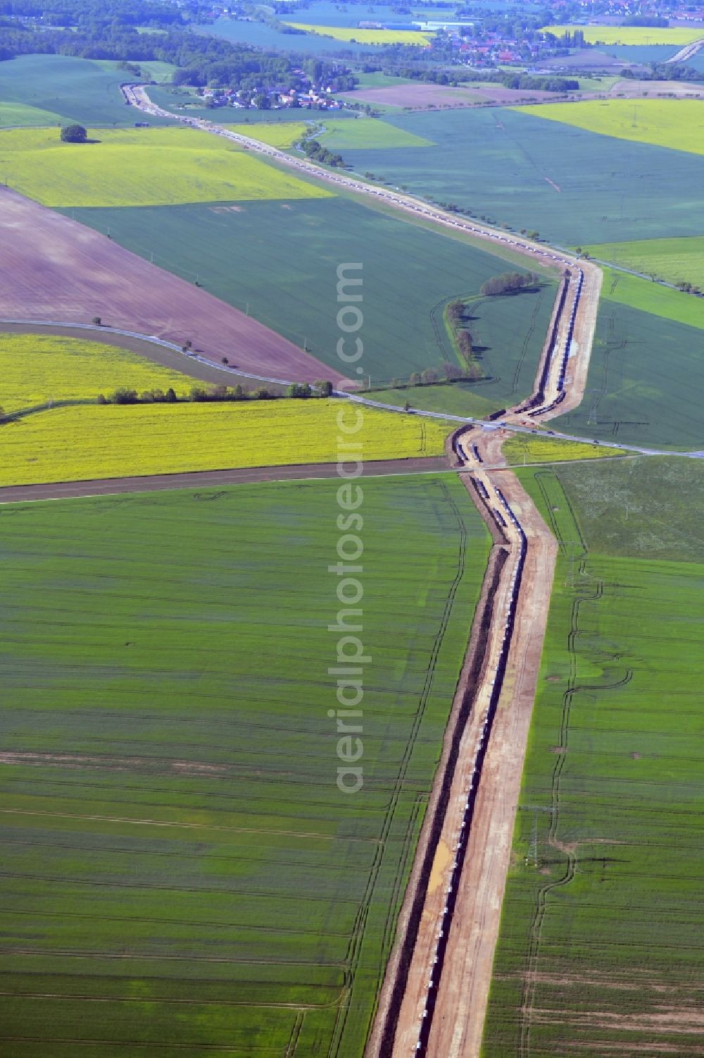 Rostig from above - Construction site with earthworks and landfills for the laying of pipelines of the new European Gas Lines (Eugal) in a forest in einem Wald in Gross Koeris in the state Brandenburg, Germany