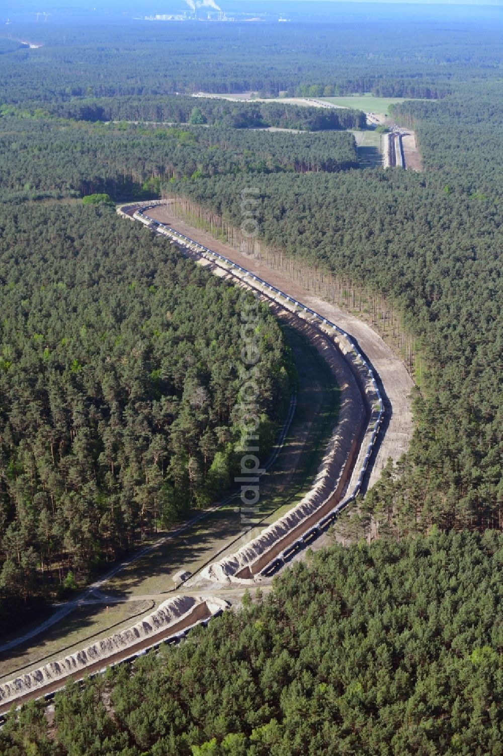 Aerial photograph Teupitz - Construction site with earthworks and landfills for the laying of pipelines of the new European Gas Lines (Eugal) in a forest in einem Wald in Gross Koeris in the state Brandenburg, Germany