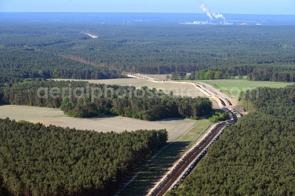 Aerial image Teupitz - Construction site with earthworks and landfills for the laying of pipelines of the new European Gas Lines (Eugal) in a forest in einem Wald in Gross Koeris in the state Brandenburg, Germany