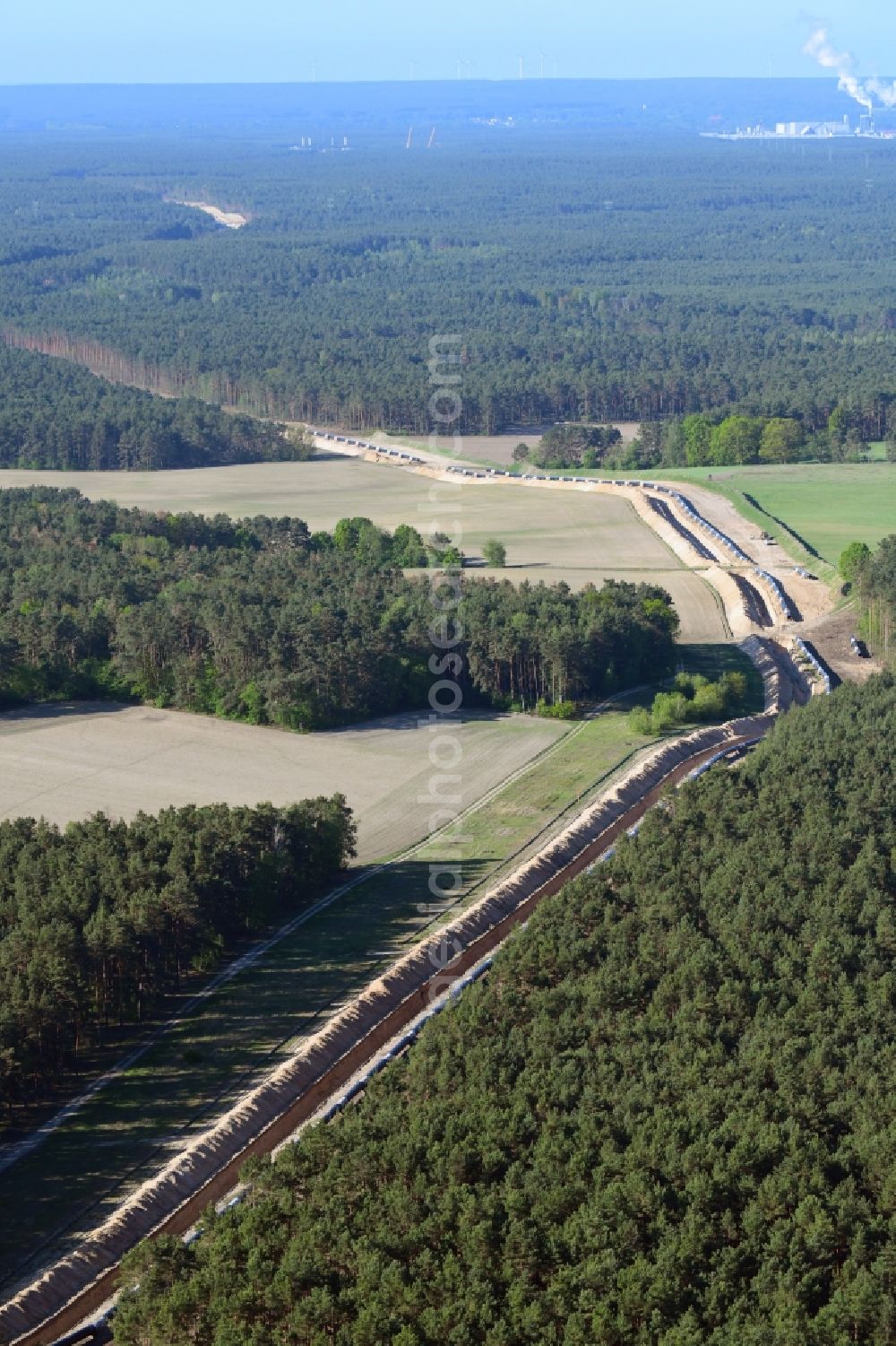 Aerial photograph Teupitz - Construction site with earthworks and landfills for the laying of pipelines of the new European Gas Lines (Eugal) in a forest in einem Wald in Gross Koeris in the state Brandenburg, Germany