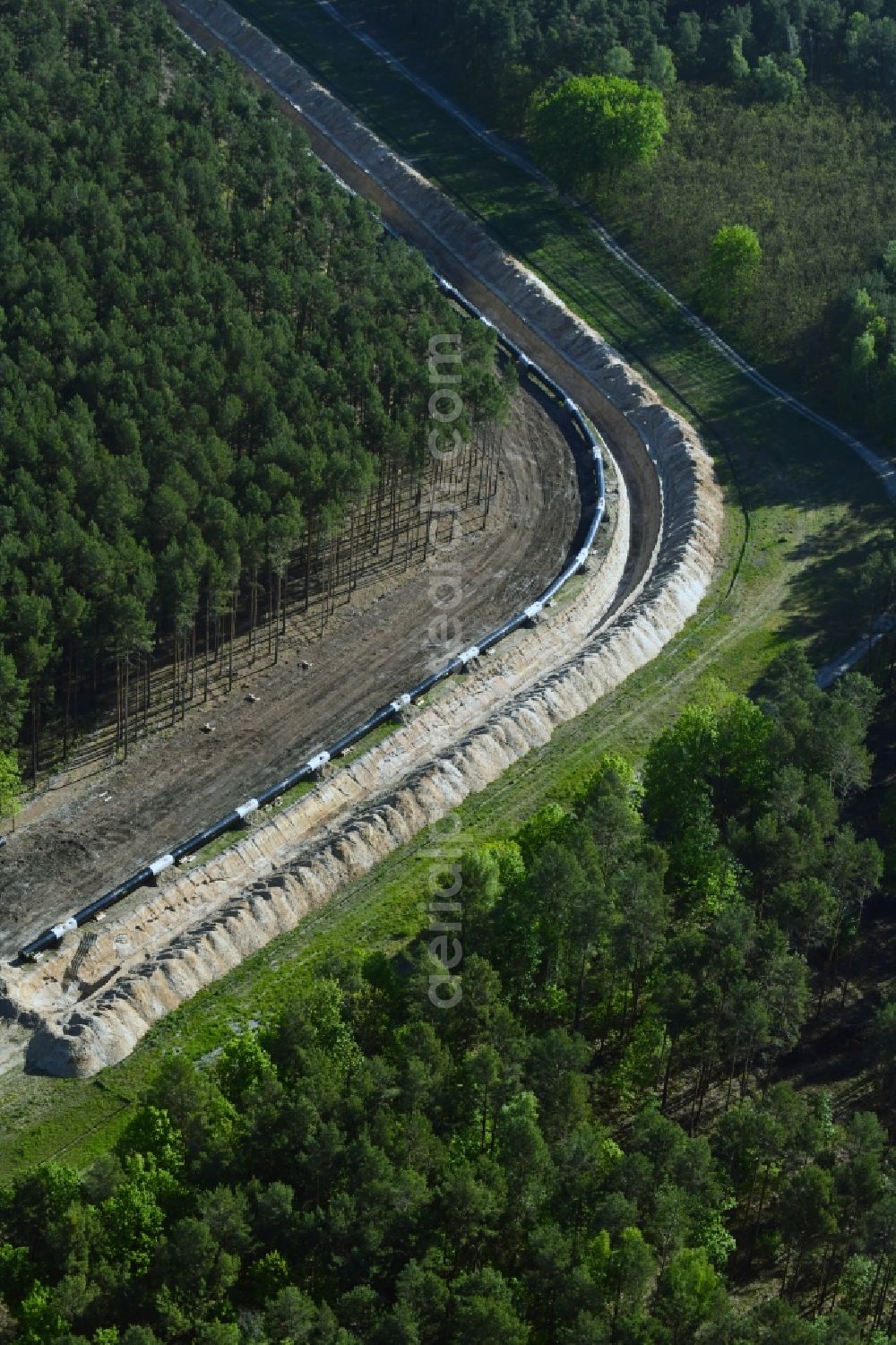 Teupitz from above - Construction site with earthworks and landfills for the laying of pipelines of the new European Gas Lines (Eugal) in a forest in einem Wald in Gross Koeris in the state Brandenburg, Germany