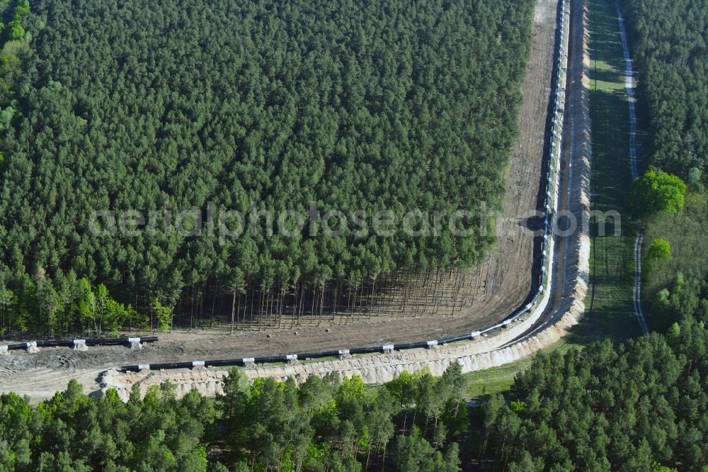 Aerial image Teupitz - Construction site with earthworks and landfills for the laying of pipelines of the new European Gas Lines (Eugal) in a forest in einem Wald in Gross Koeris in the state Brandenburg, Germany