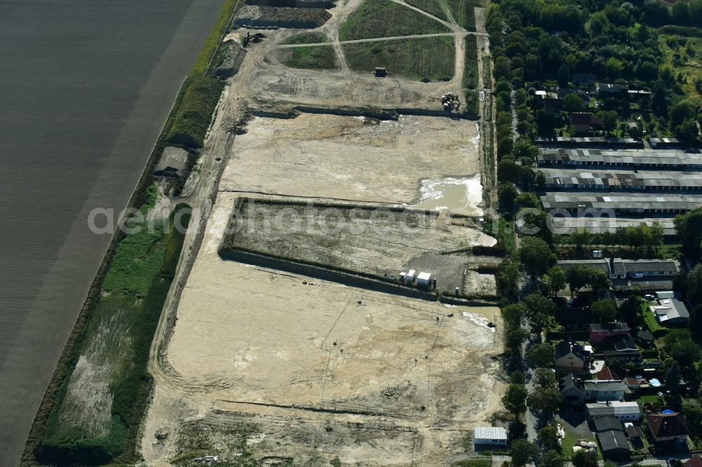 Aerial photograph Rüdersdorf - Construction site for the preparation of a new residential area on Woltersdorfer Strasse in Ruedersdorf in the state of Brandenburg. The area is being prepared to facilitate the construction of new residential buildings and apartment blocks