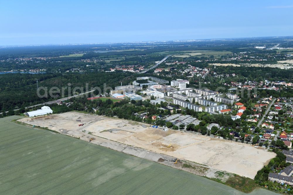 Rüdersdorf from the bird's eye view: Construction site for the preparation of a new residential area on Woltersdorfer Strasse in Ruedersdorf in the state of Brandenburg. The area is being prepared to facilitate the construction of new residential buildings and apartment blocks