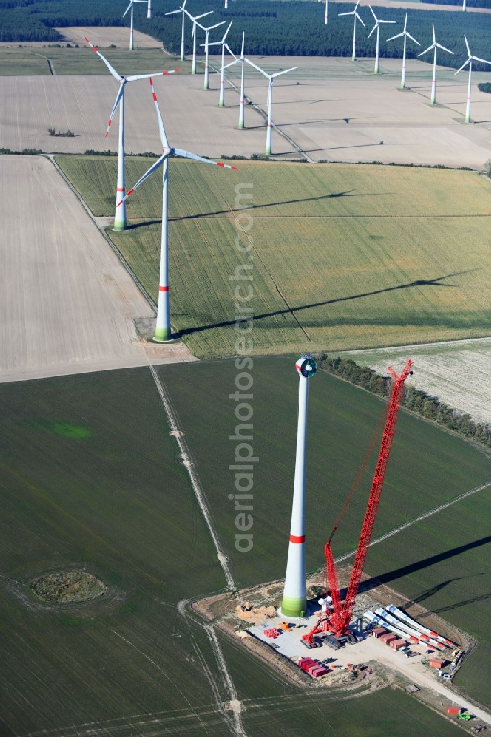 Aerial image Niedergörsdorf - Construction site for wind turbine installation on a field in Niedergoersdorf in the state Brandenburg, Germany