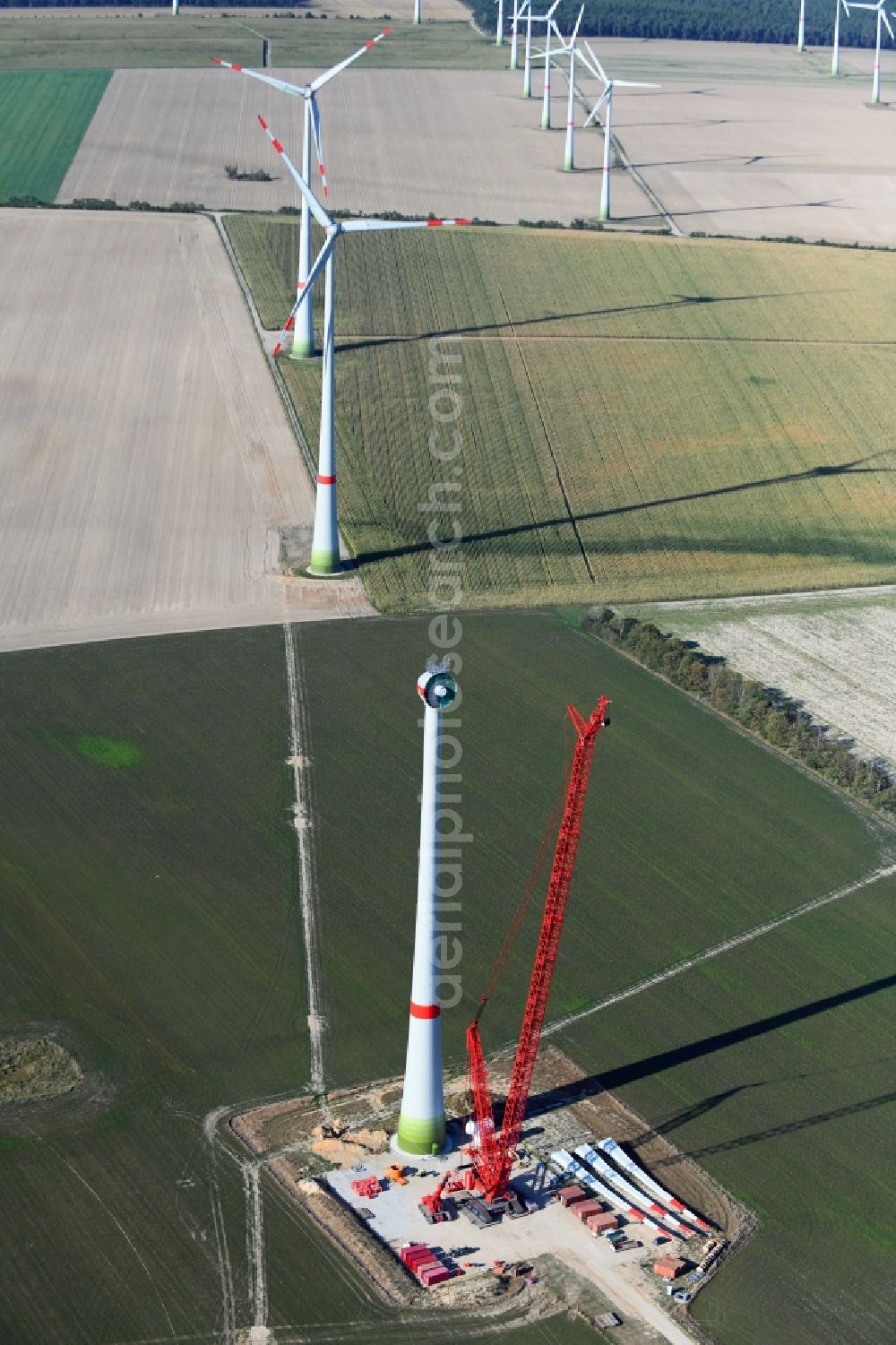 Aerial photograph Niedergörsdorf - Construction site for wind turbine installation on a field in Niedergoersdorf in the state Brandenburg, Germany