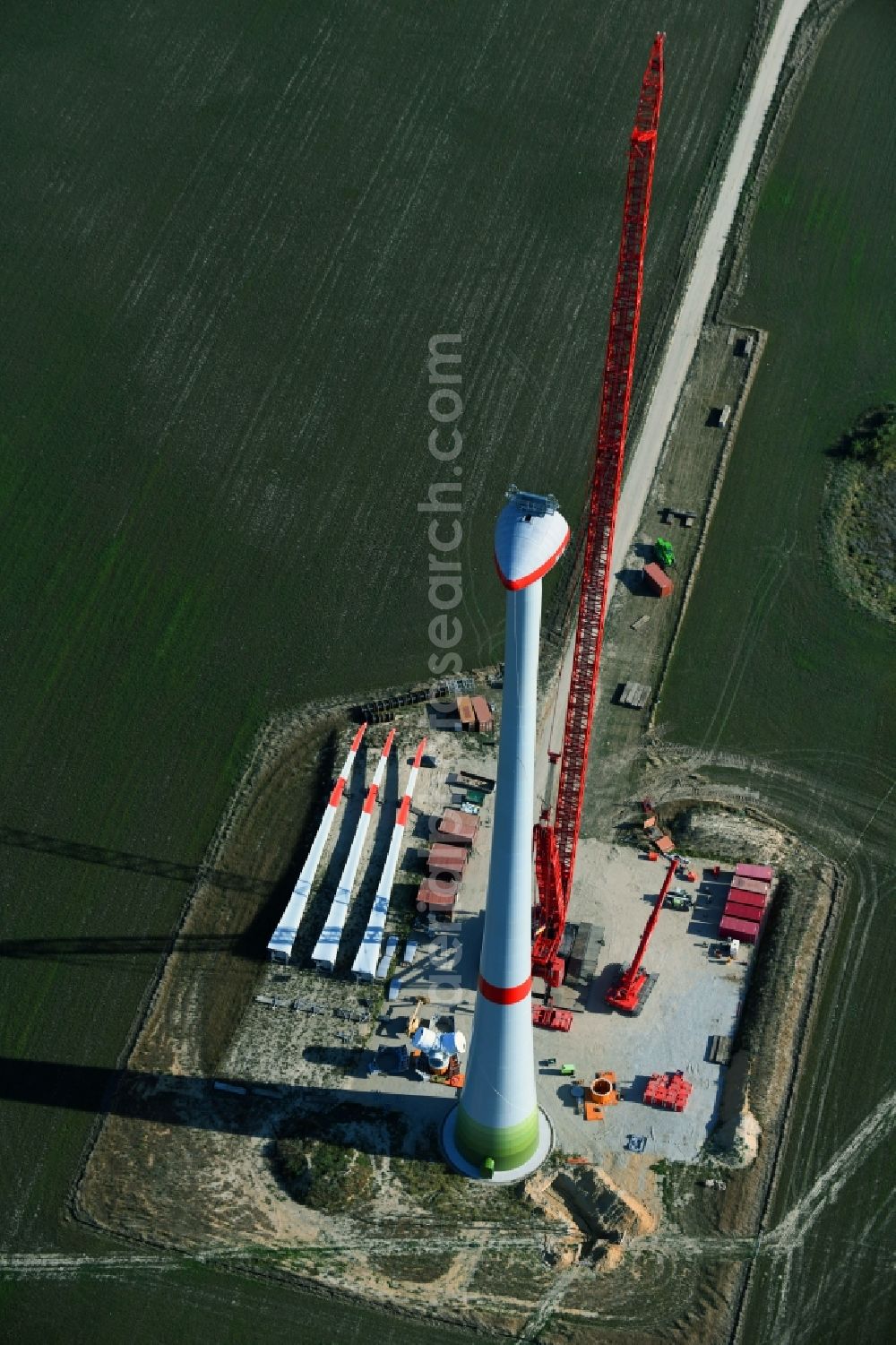 Aerial image Niedergörsdorf - Construction site for wind turbine installation on a field in Niedergoersdorf in the state Brandenburg, Germany