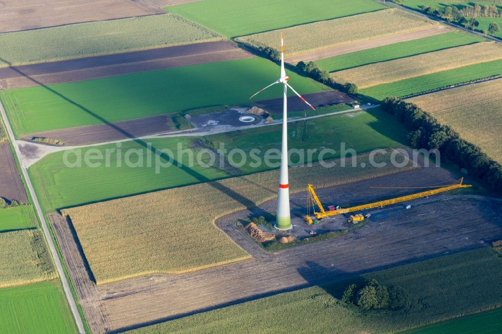 Kutenholz from above - Construction site for wind turbine installation with long shade in Kutenholz in the state Lower Saxony, Germany