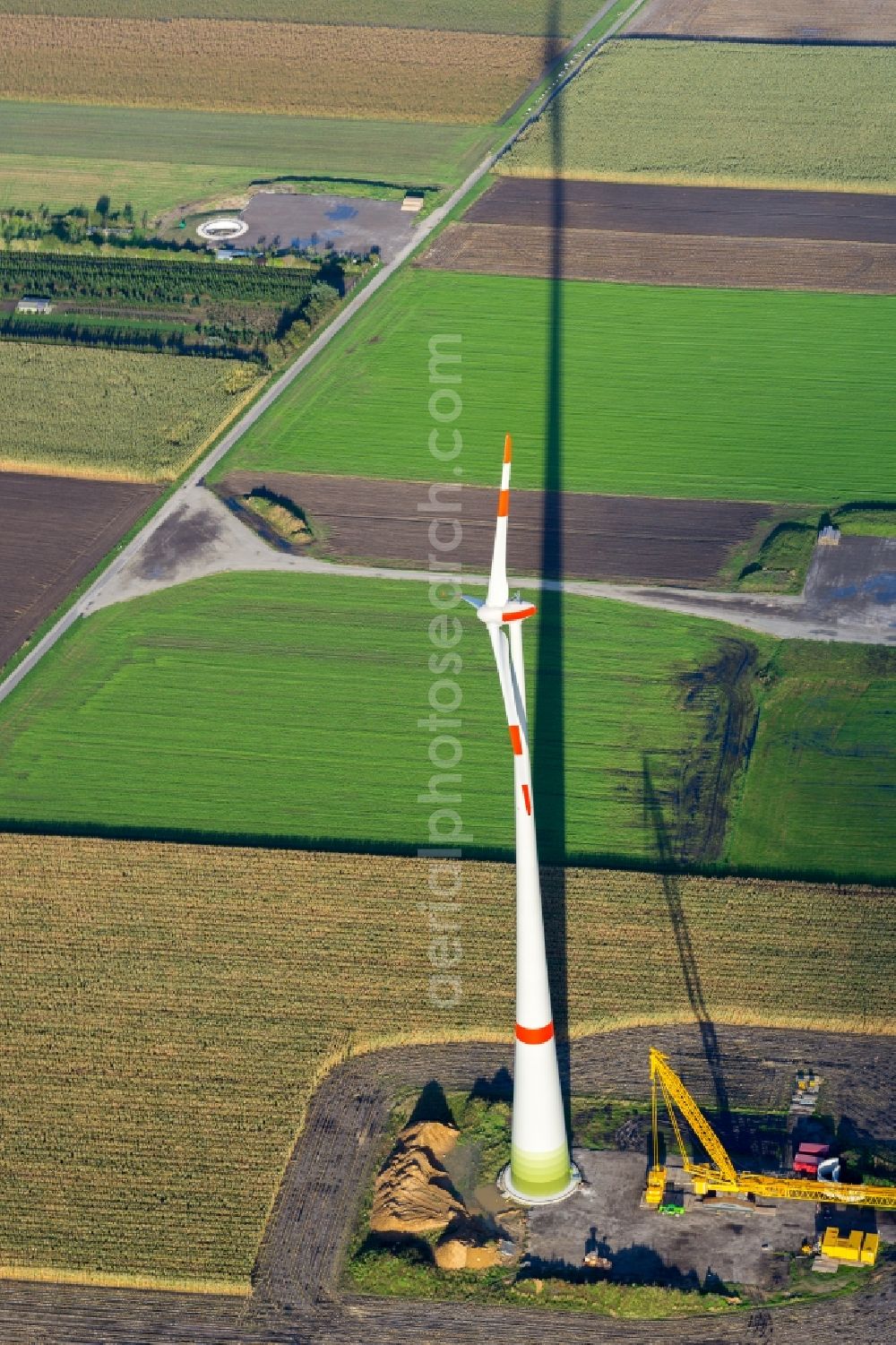 Kutenholz from above - Construction site for wind turbine installation with long shade in Kutenholz in the state Lower Saxony, Germany