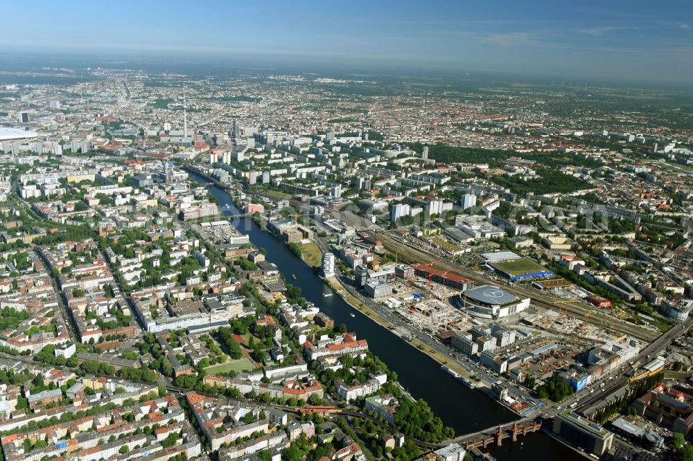 Aerial image Berlin - Development area and construction sites on the Anschutzareal at the Mercedes-Benz-Arena on the banks of the River Spree in Friedrichshain. The Anschutz Entertainment Group (AEG) is developing the site through numerous hotel and commercial building new buildings