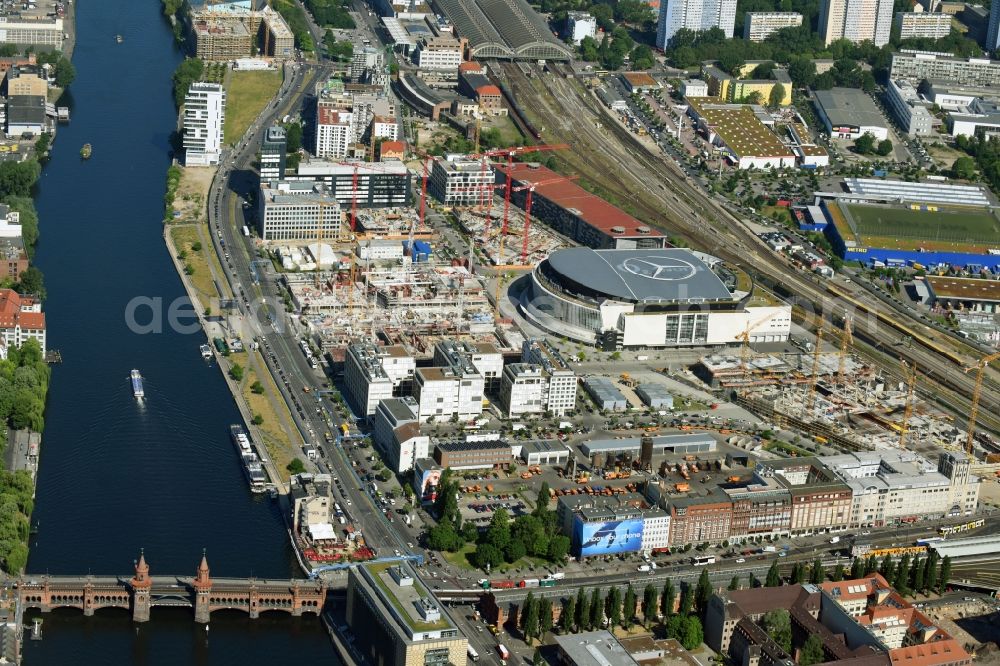 Berlin from above - Development area and construction sites on the Anschutzareal at the Mercedes-Benz-Arena on the banks of the River Spree in Friedrichshain. The Anschutz Entertainment Group (AEG) is developing the site through numerous hotel and commercial building new buildings