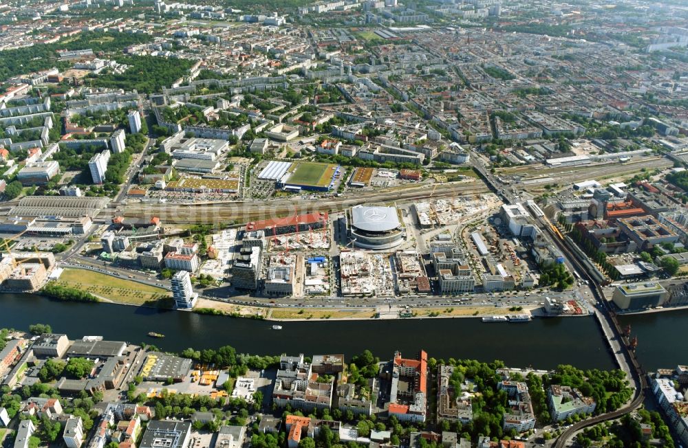 Berlin from above - Development area and construction sites on the Anschutzareal at the Mercedes-Benz-Arena on the banks of the River Spree in Friedrichshain. The Anschutz Entertainment Group (AEG) is developing the site through numerous hotel and commercial building new buildings