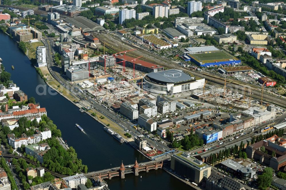 Berlin from above - Development area and construction sites on the Anschutzareal at the Mercedes-Benz-Arena on the banks of the River Spree in Friedrichshain. The Anschutz Entertainment Group (AEG) is developing the site through numerous hotel and commercial building new buildings