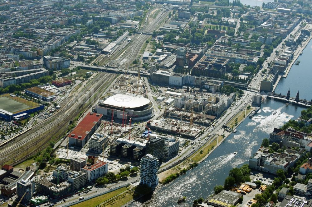 Berlin from above - Development area and construction sites on the Anschutzareal at the Mercedes-Benz-Arena on the banks of the River Spree in Friedrichshain. The Anschutz Entertainment Group (AEG) is developing the site through numerous hotel and commercial building new buildings