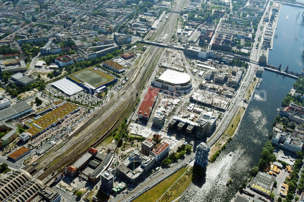 Berlin from above - Development area and construction sites on the Anschutzareal at the Mercedes-Benz-Arena on the banks of the River Spree in Friedrichshain. The Anschutz Entertainment Group (AEG) is developing the site through numerous hotel and commercial building new buildings