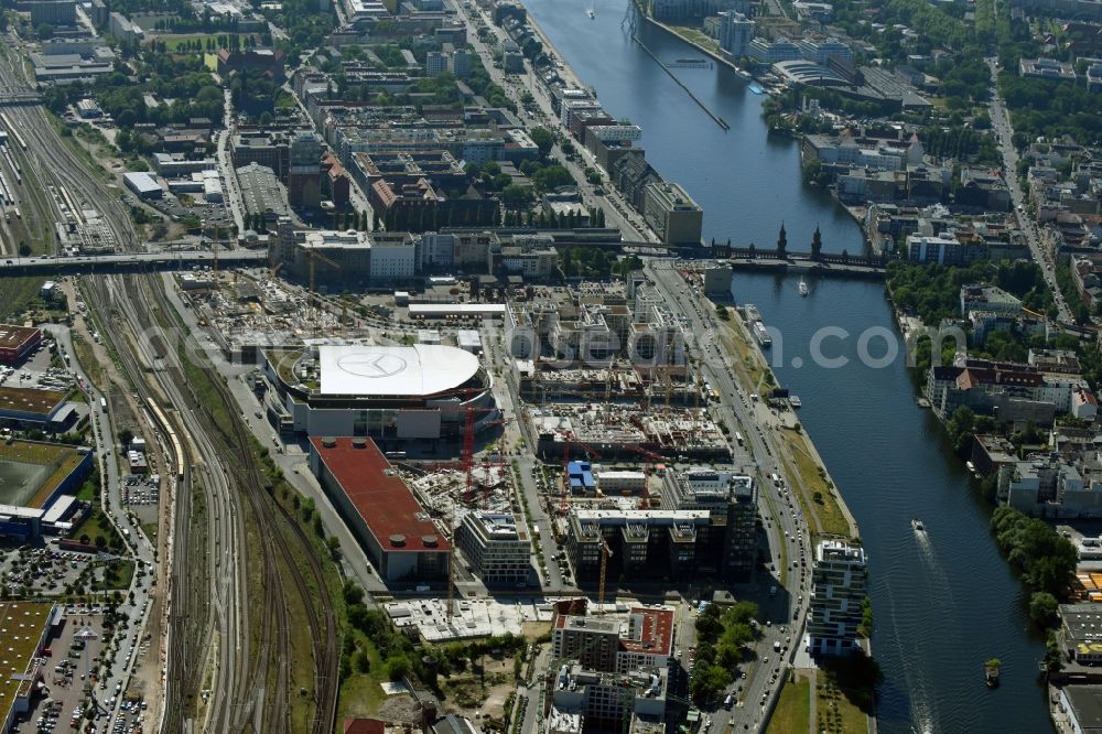 Berlin from above - Development area and construction sites on the Anschutzareal at the Mercedes-Benz-Arena on the banks of the River Spree in Friedrichshain. The Anschutz Entertainment Group (AEG) is developing the site through numerous hotel and commercial building new buildings