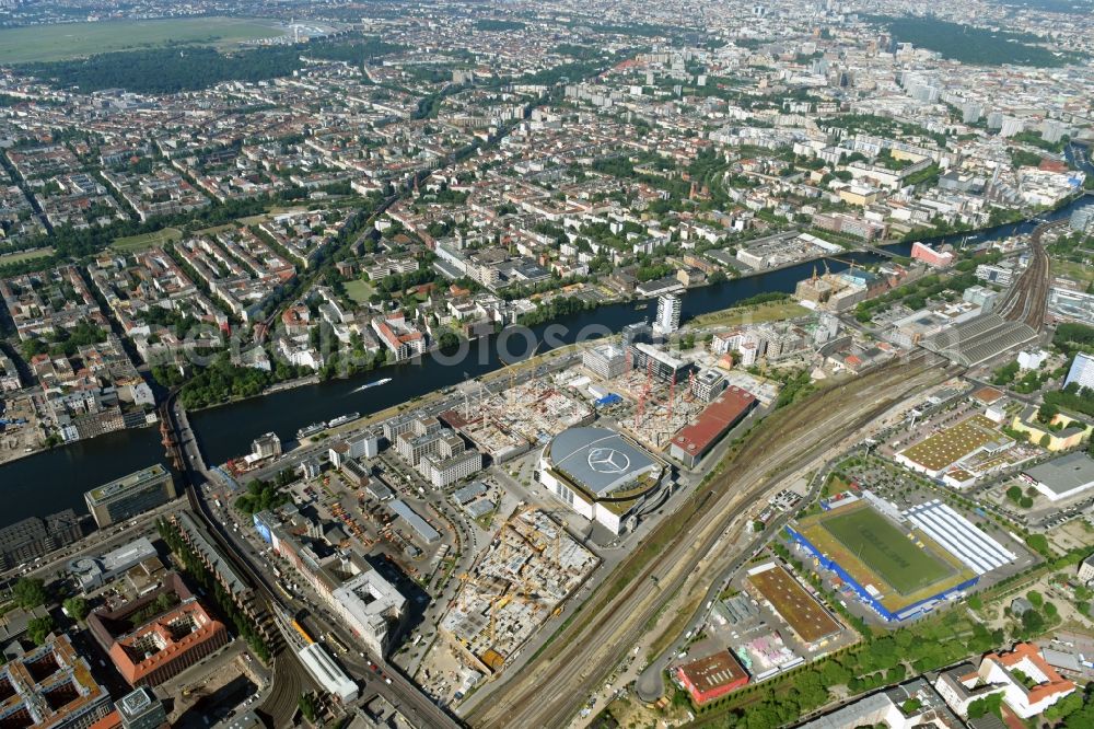 Berlin from above - Development area and construction sites on the Anschutzareal at the Mercedes-Benz-Arena on the banks of the River Spree in Friedrichshain. The Anschutz Entertainment Group (AEG) is developing the site through numerous hotel and commercial building new buildings