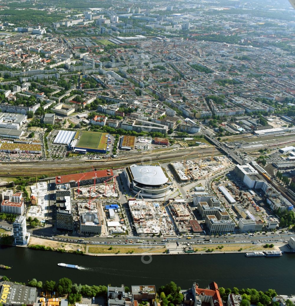 Berlin from above - Development area and construction sites on the Anschutzareal at the Mercedes-Benz-Arena on the banks of the River Spree in Friedrichshain. The Anschutz Entertainment Group (AEG) is developing the site through numerous hotel and commercial building new buildings