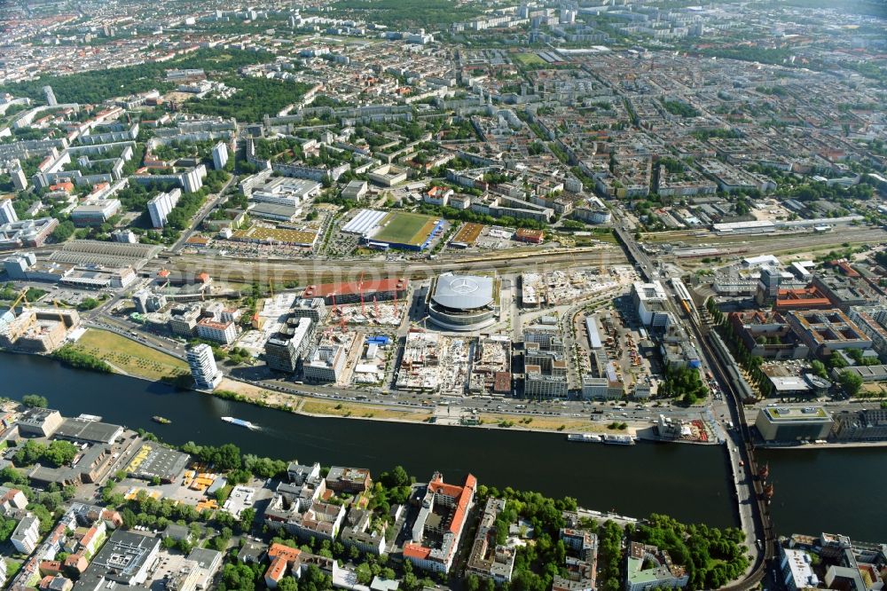 Berlin from above - Development area and construction sites on the Anschutzareal at the Mercedes-Benz-Arena on the banks of the River Spree in Friedrichshain. The Anschutz Entertainment Group (AEG) is developing the site through numerous hotel and commercial building new buildings