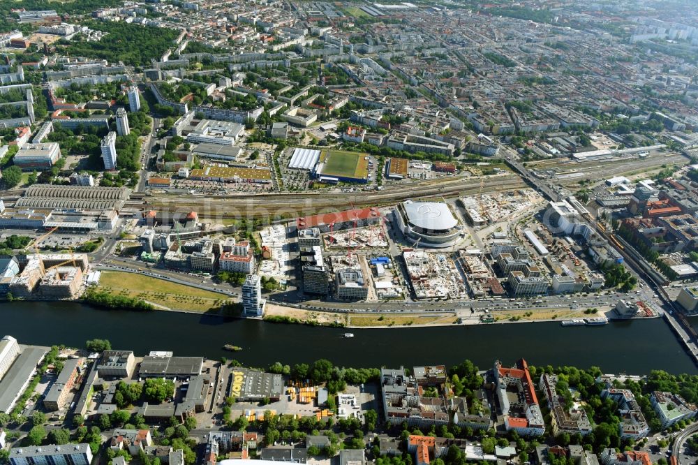 Aerial image Berlin - Development area and construction sites on the Anschutzareal at the Mercedes-Benz-Arena on the banks of the River Spree in Friedrichshain. The Anschutz Entertainment Group (AEG) is developing the site through numerous hotel and commercial building new buildings