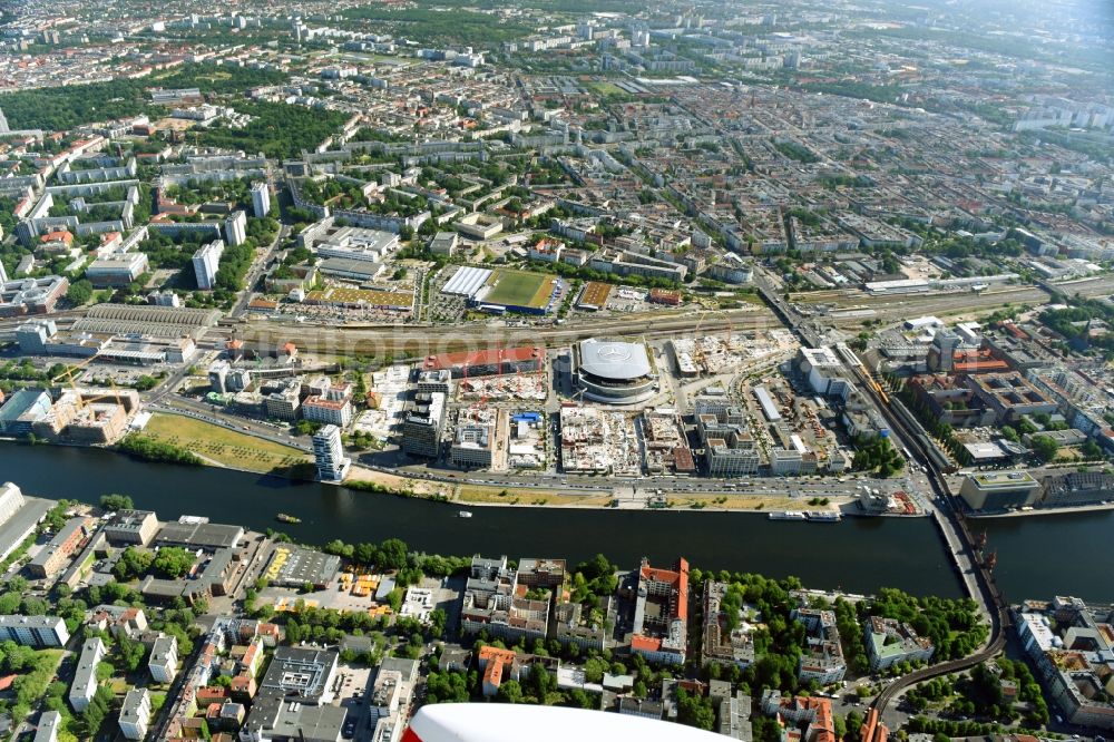 Berlin from above - Development area and construction sites on the Anschutzareal at the Mercedes-Benz-Arena on the banks of the River Spree in Friedrichshain. The Anschutz Entertainment Group (AEG) is developing the site through numerous hotel and commercial building new buildings