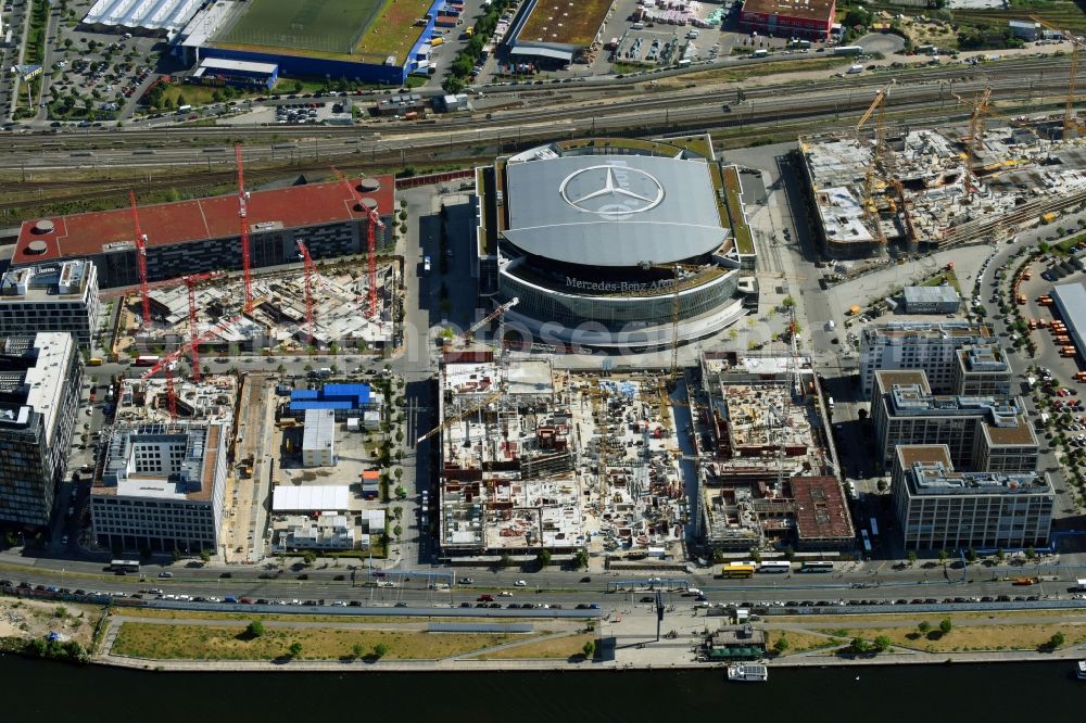 Berlin from above - Development area and construction sites on the Anschutzareal at the Mercedes-Benz-Arena on the banks of the River Spree in Friedrichshain. The Anschutz Entertainment Group (AEG) is developing the site through numerous hotel and commercial building new buildings