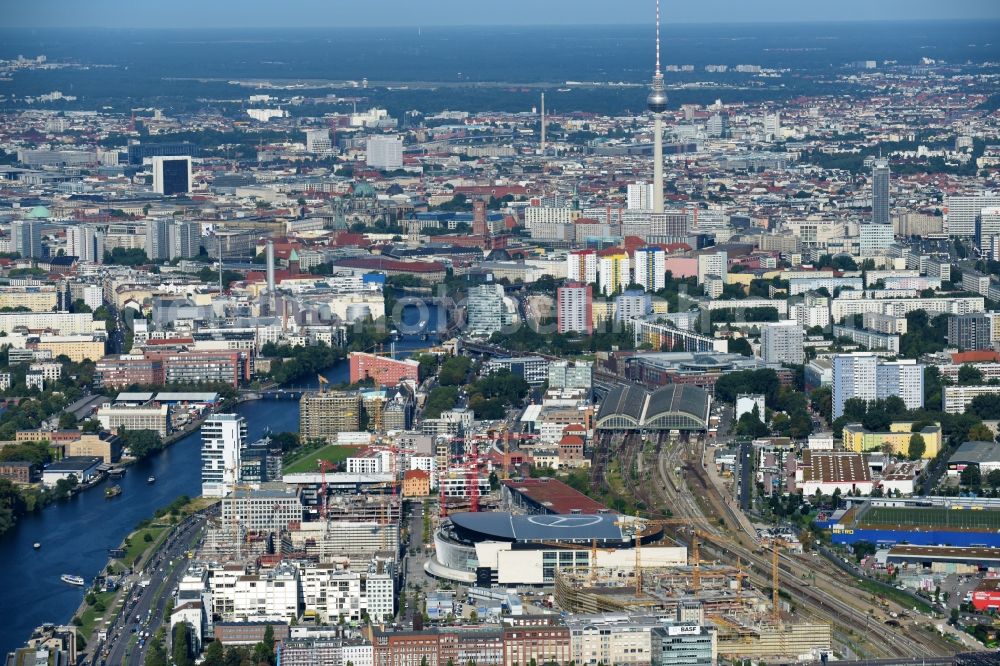 Berlin from above - Development area and construction sites on the Anschutzareal at the Mercedes-Benz-Arena on the banks of the River Spree in Friedrichshain. The Anschutz Entertainment Group (AEG) is developing the site through numerous hotel and commercial building new buildings