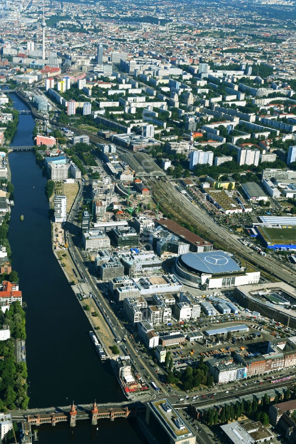 Berlin from the bird's eye view: Construction sites for the new building on Anschutz- Areal along of Muehlenstrasse in the district Friedrichshain in Berlin, Germany