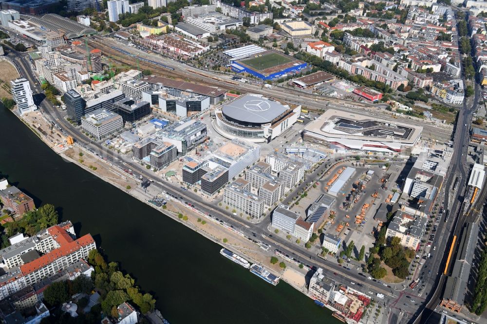 Berlin from the bird's eye view: Construction sites for the new building on Anschutz- Areal along of Muehlenstrasse in the district Friedrichshain in Berlin, Germany