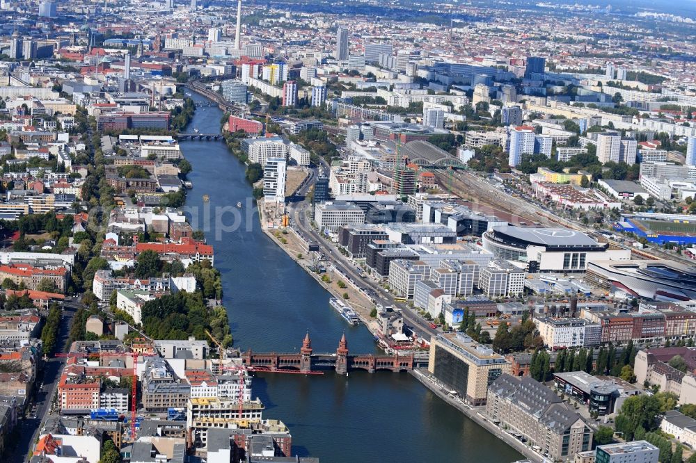 Berlin from the bird's eye view: Construction sites for the new building on Anschutz- Areal along of Muehlenstrasse in the district Friedrichshain in Berlin, Germany