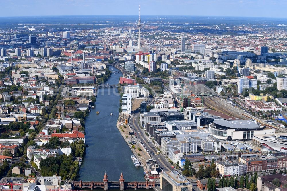 Berlin from the bird's eye view: Construction sites for the new building on Anschutz- Areal along of Muehlenstrasse in the district Friedrichshain in Berlin, Germany