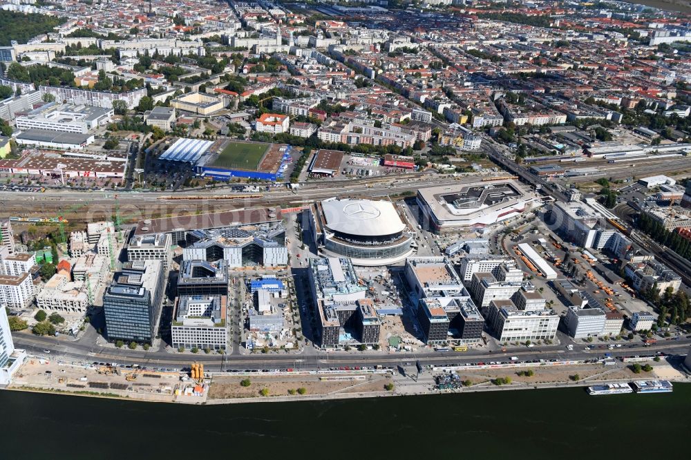 Berlin from the bird's eye view: Construction sites for the new building on Anschutz- Areal along of Muehlenstrasse in the district Friedrichshain in Berlin, Germany