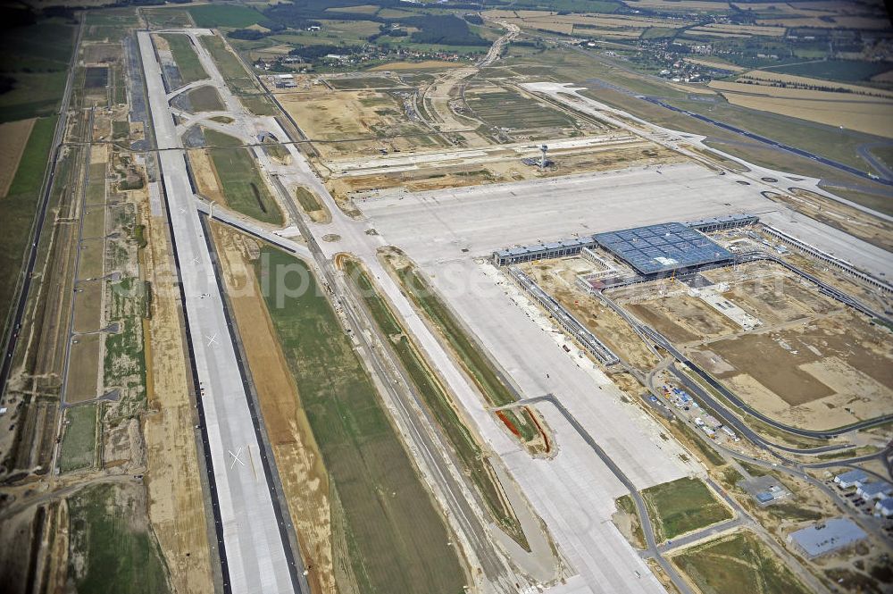 Schönefeld from above - Blick auf die Baustellen am Flughafen Berlin-Schönefeld BBI (SXF). Ausführende Firmen: Hochtief AG; EUROVIA Beton; PORR; BERGER Bau; Karl Weiss; Matthai; Schäler Bau Berlin GmbH; STRABAG; MAX BÖGL. Construction fields at Berlin-Schoenefeld Airport BBI.