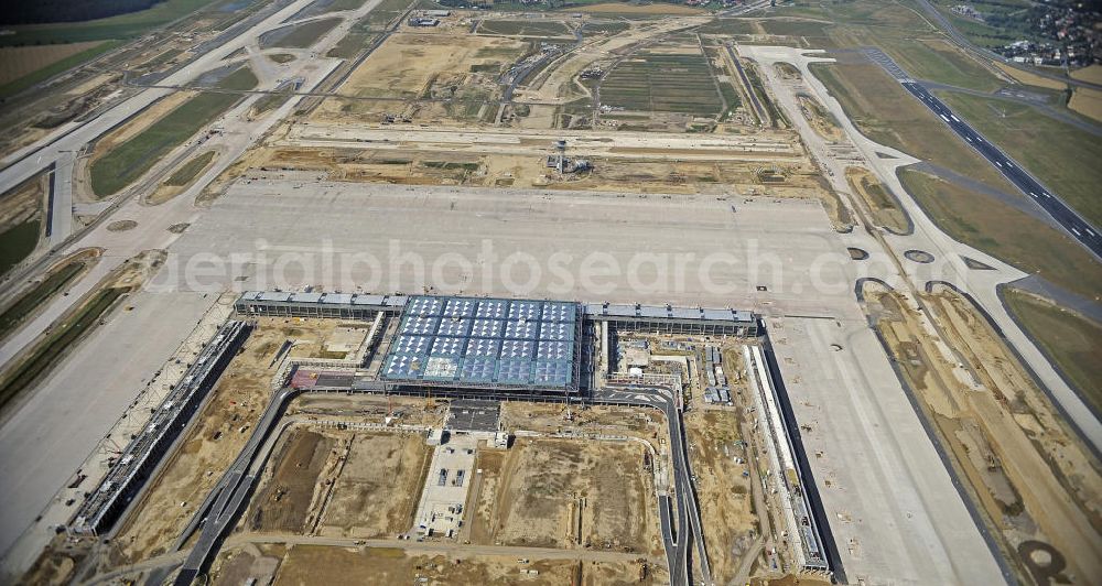 Schönefeld from the bird's eye view: Blick auf die Baustellen am Flughafen Berlin-Schönefeld BBI (SXF). Ausführende Firmen: Hochtief AG; EUROVIA Beton; PORR; BERGER Bau; Karl Weiss; Matthai; Schäler Bau Berlin GmbH; STRABAG; MAX BÖGL. Construction fields at Berlin-Schoenefeld Airport BBI.