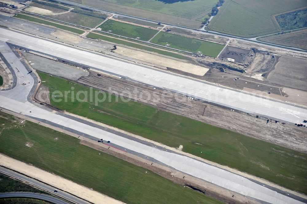 Schönefeld bei Berlin from above - Blick auf die Baustellen am Flughafen Berlin-Schönefeld BBI (SXF). Ausführende Firmen: Hochtief AG; EUROVIA Beton; PORR; BERGER Bau; Karl Weiss; Matthai; Schäler Bau Berlin GmbH; STRABAG; MAX BÖGL. Construction fields at Berlin-Schoenefeld Airport BBI.