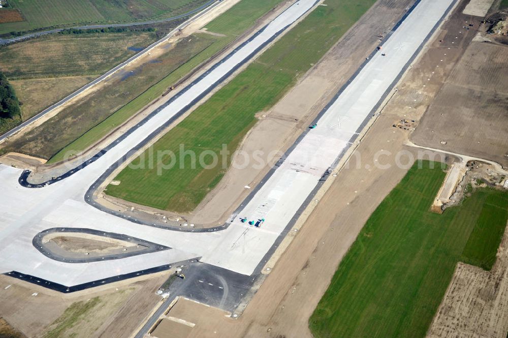 Aerial image Schönefeld bei Berlin - Blick auf die Baustellen am Flughafen Berlin-Schönefeld BBI (SXF). Ausführende Firmen: Hochtief AG; EUROVIA Beton; PORR; BERGER Bau; Karl Weiss; Matthai; Schäler Bau Berlin GmbH; STRABAG; MAX BÖGL. Construction fields at Berlin-Schoenefeld Airport BBI.