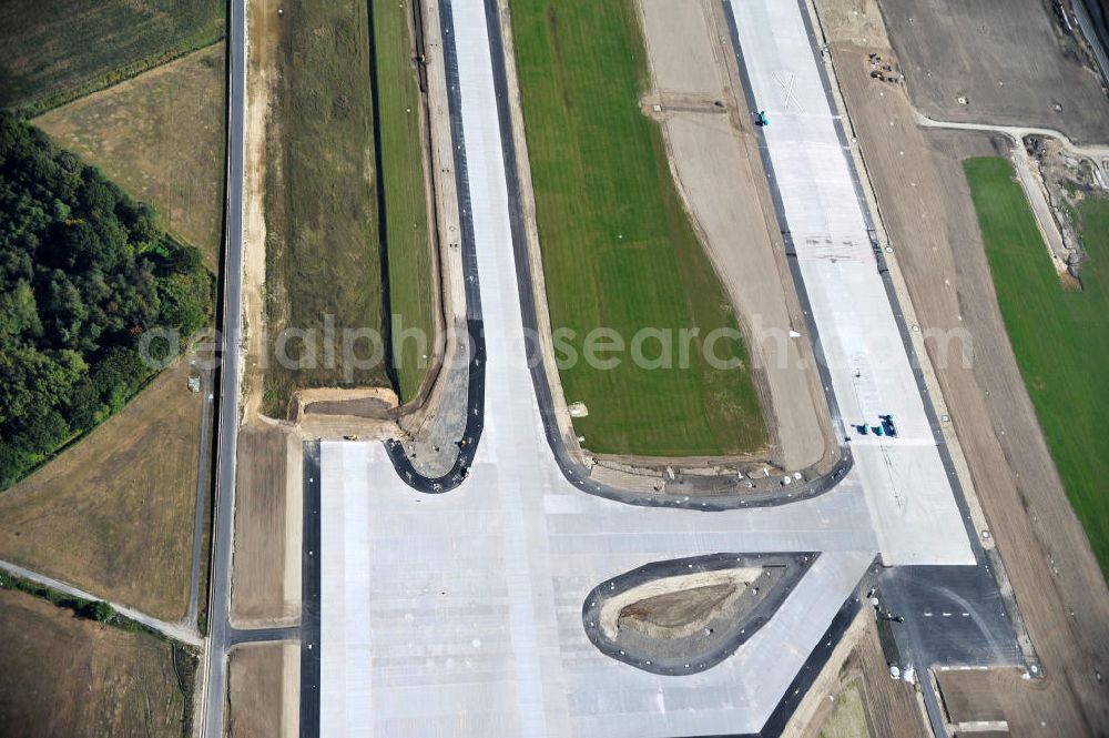 Schönefeld bei Berlin from the bird's eye view: Blick auf die Baustellen am Flughafen Berlin-Schönefeld BBI (SXF). Ausführende Firmen: Hochtief AG; EUROVIA Beton; PORR; BERGER Bau; Karl Weiss; Matthai; Schäler Bau Berlin GmbH; STRABAG; MAX BÖGL. Construction fields at Berlin-Schoenefeld Airport BBI.