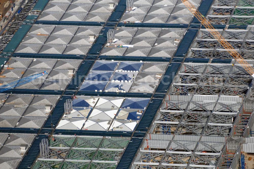 Aerial photograph Schönefeld - Blick auf die Baustellen am Flughafen Berlin-Schönefeld BBI (SXF). Ausführende Firmen: Hochtief AG; EUROVIA Beton; PORR; BERGER Bau; Karl Weiss; Matthai; Schäler Bau Berlin GmbH; STRABAG; MAX BÖGL. Baustellen am Flughafen Berlin-Schönefeld BBI - Construction fields at Berlin-Schoenefeld Airport BBI.