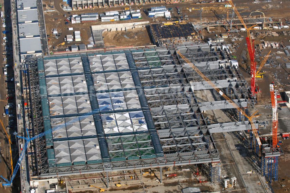 Schönefeld from the bird's eye view: Blick auf die Baustellen am Flughafen Berlin-Schönefeld BBI (SXF). Ausführende Firmen: Hochtief AG; EUROVIA Beton; PORR; BERGER Bau; Karl Weiss; Matthai; Schäler Bau Berlin GmbH; STRABAG; MAX BÖGL. Baustellen am Flughafen Berlin-Schönefeld BBI - Construction fields at Berlin-Schoenefeld Airport BBI.