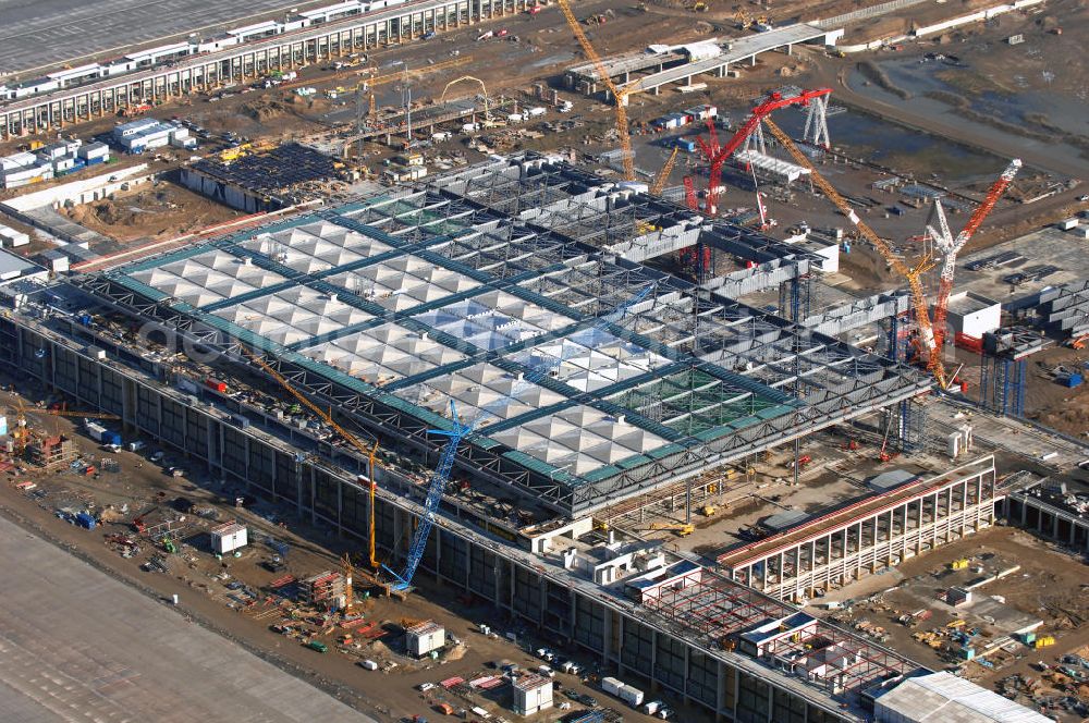 Schönefeld from above - Blick auf die Baustellen am Flughafen Berlin-Schönefeld BBI (SXF). Ausführende Firmen: Hochtief AG; EUROVIA Beton; PORR; BERGER Bau; Karl Weiss; Matthai; Schäler Bau Berlin GmbH; STRABAG; MAX BÖGL. Baustellen am Flughafen Berlin-Schönefeld BBI - Construction fields at Berlin-Schoenefeld Airport BBI.